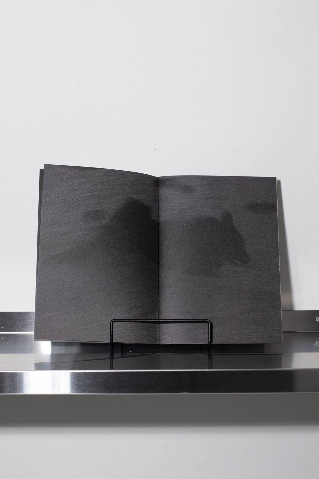 Running with a black dog on a black sand beach – BLACK WAX PRESS