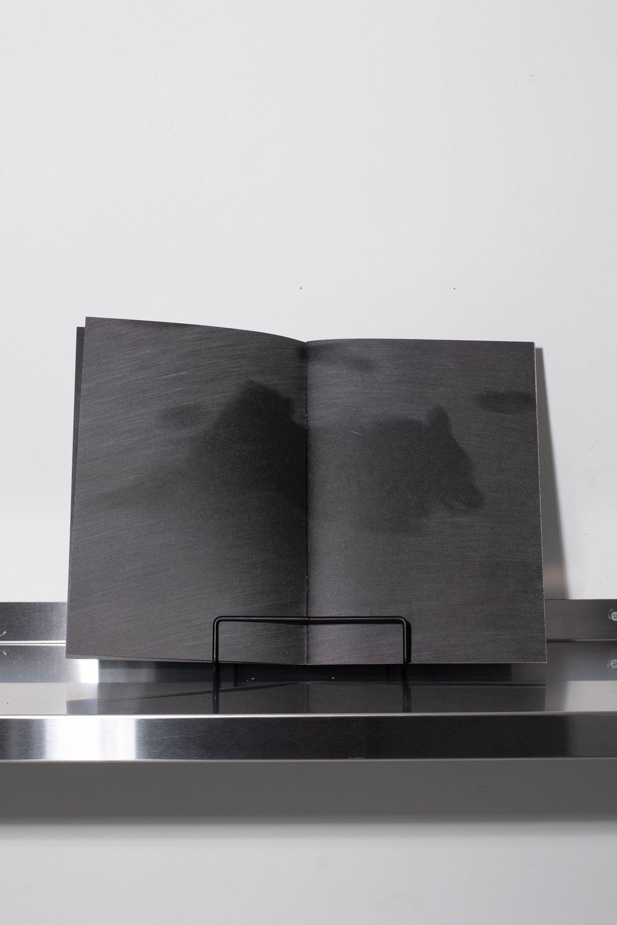 Running with a black dog on a black sand beach – BLACK WAX PRESS